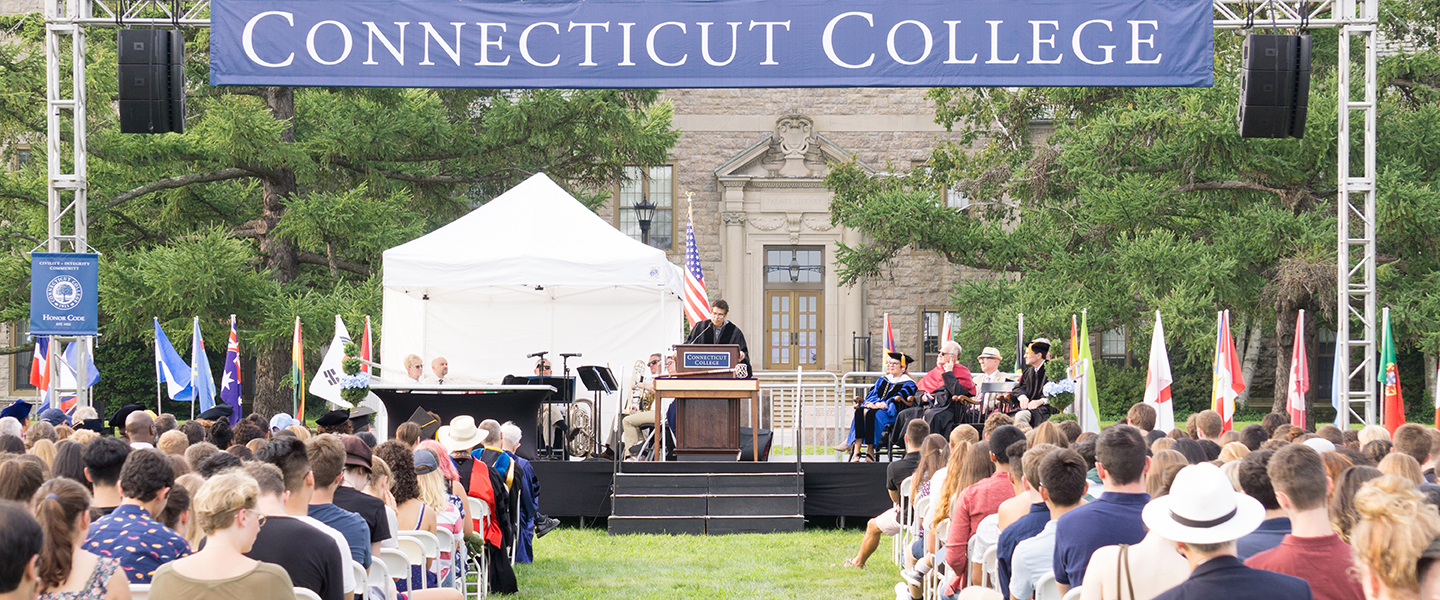 Professor Sunil Bhatia delivers the keynote speech at Convocation from the podium on the stage. 