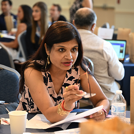 Bharti Chhibber, portraying Sen. Richard Durbin (D-Illinois) makes a point to her group during the United States Department of State Study of the United States Institutes (SUSI) foreign policy program hosted by MaryAnne Borrelli, Susan Eckert Lynch ’62 Professor of Government, Thursday, July 13, 2023 in the 1941 Room.