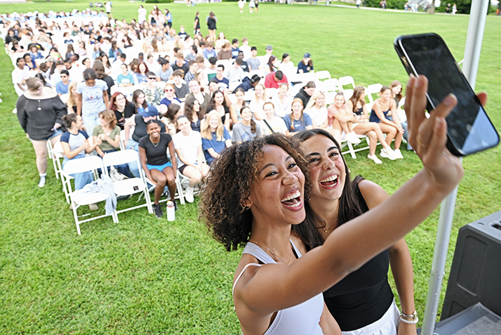 Students take a selfie at a Welcome Weekend event on Tempel Green.