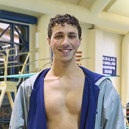 Justin Finkel '25 smiles after being named NESCAC Swimmer of the Year at the NESCAC Men's Swimming and Diving Championships.