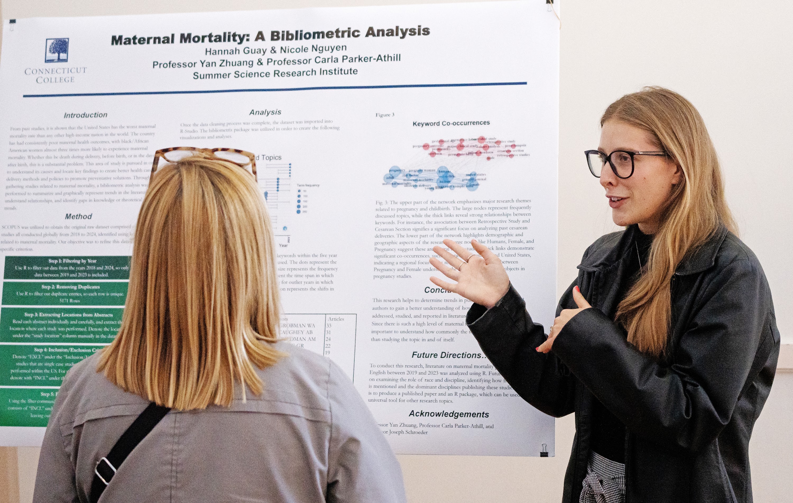 Hannah Guay ’25 discusses her research during the Summer Science Research Institute poster session during Fall Weekend on Oct. 18 in the 1941 Room. (Connecticut College photo by Edward Harrison ’28)